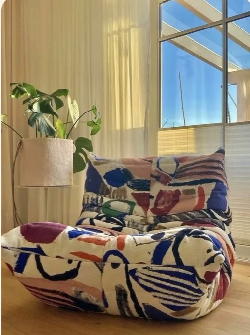 Graffiti Togo chair by the window in Sarah's apartment
